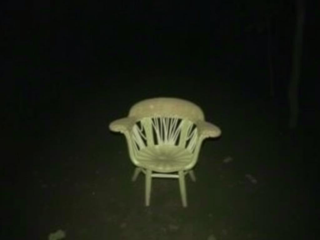 Main Subject A Person Wearing A Hooded Sweatshirt (hood Up) Sits At A Table The Person’s Face Is